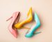 Bright colored women's shoes on a solid background. Copy space text.