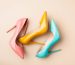 Bright colored women's shoes on a solid background. Copy space text.